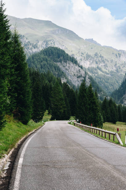istock Mountain road in Dolomites after rain 1249013328