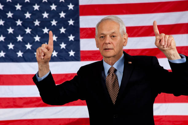 istock Politician number one hand gesture, American flag background 1249015111