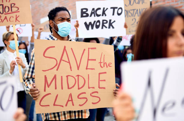 istock Unemployed African American man marching on anti-lockdown protest. 1249018223