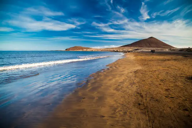 view of Playa el Medano beach with Montana Roja mountain on the background, Tenerife, Canary islands, Spain