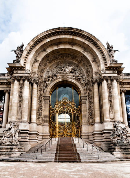 The Petit Palais built for the world expo in 1900, it now houses the City of Paris Museum of Fine Arts. The beautiful golden door is closed and the street is empty during epidemic Covid19 virus in France. Picture 11x15.  Paris in France. June 5, 2020.
