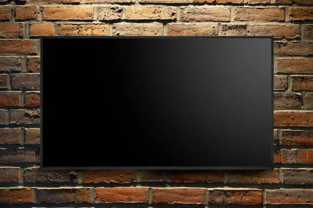 modern tv on old-fashioned brick wall