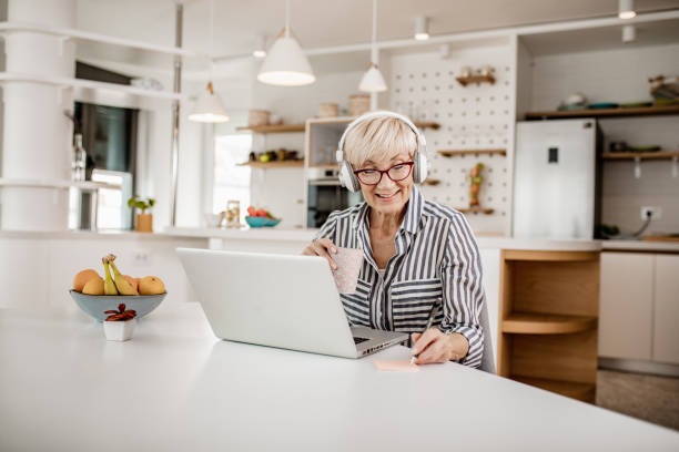 istock Mature woman is working from home 1249022204