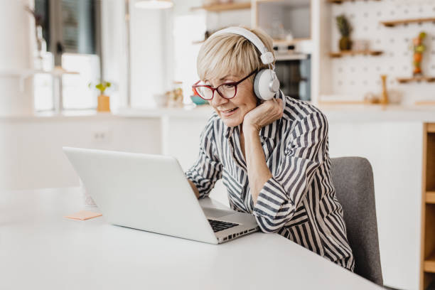 istock Mature woman is working from home 1249022289