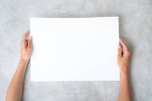 istock Girl's holding a paper 1249025241