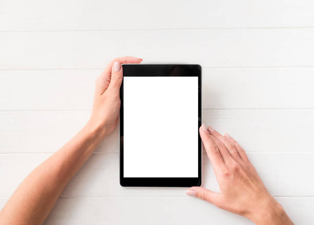 istock Top view of girl using tablet 1249025255