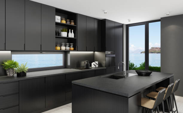 istock Luxurious matte black kitchen with island table at seaside background 1249038828