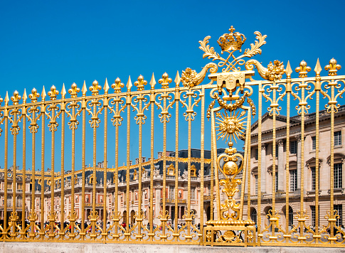 Château de Versailles : the beautiful golden gate. It was an official residence of the kings of France and is now a World Heritage Site. Picture 11x15. Versailles, near Paris in France. April 30, 2019
