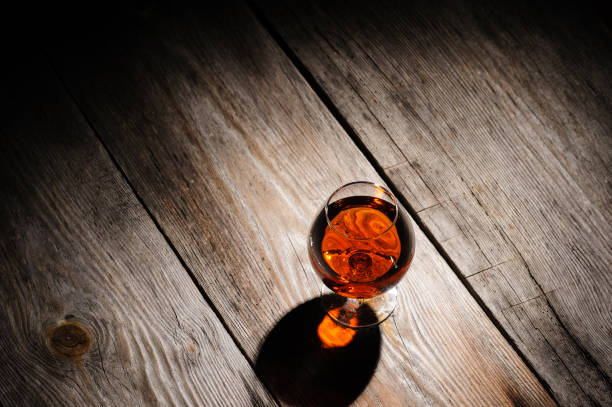 istock cognac on the wooden table 1249039998