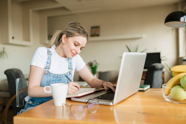 istock Happy female freelancer working from home 1249040110