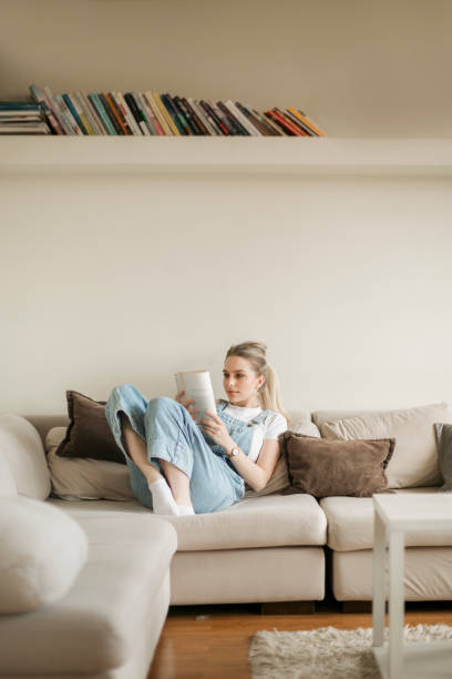 istock Young blonde woman studying at home 1249040238
