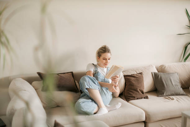istock Young blonde woman studying at home 1249040244