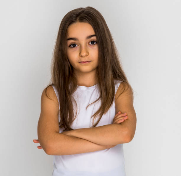 istock Girl put his hands on chest looking sad 1249041538