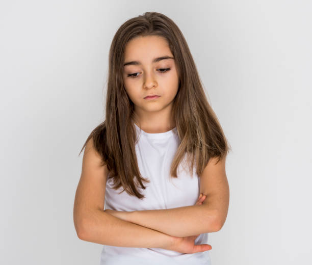 istock Girl put his hands on chest looking sad 1249041539