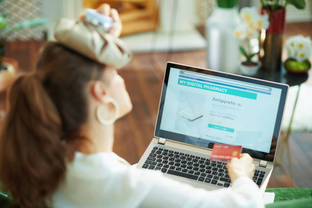 istock ill woman with headache ice pack buying pharma 1249041690