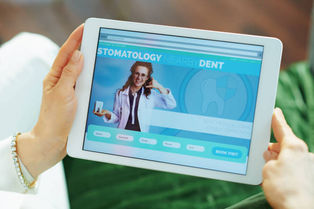 istock stylish woman with opened digital stomatology site 1249041908