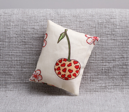 Little cushion with cherry and heart decoration