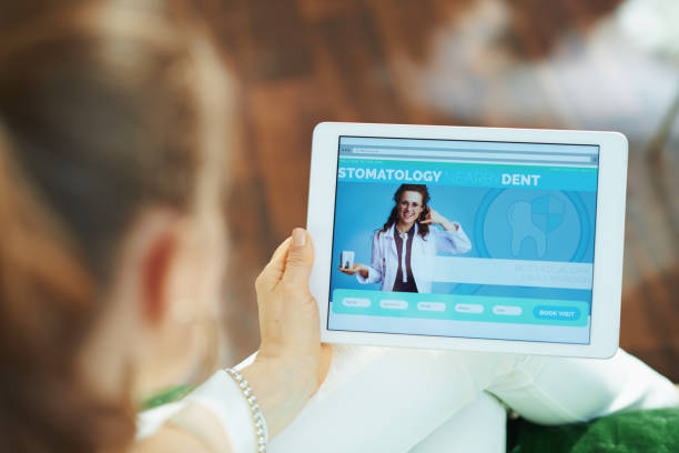 istock stylish woman with opened digital dental site 1249044178