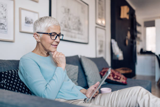 istock Senior woman using tablet to work online 1249050102