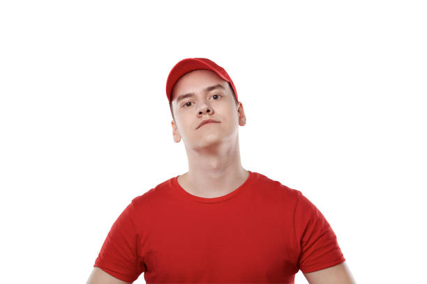 istock Portrait of a young guy from a delivery service. Red uniform. 1249051181