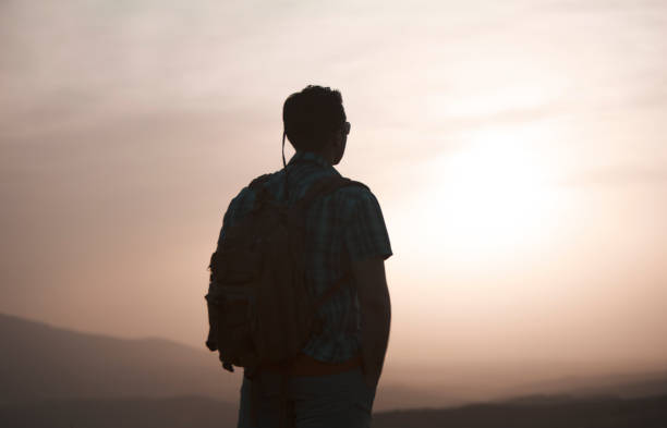 istock silhouette of people facing the sunset view 1249067464