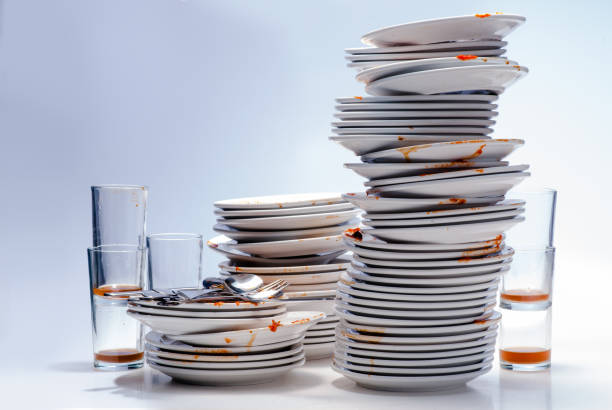 istock Many dirty dishes stacked. 1249074276