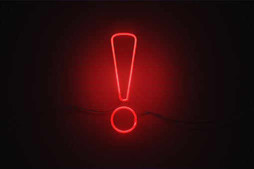 Exclamation point symbol drawn by red neon light on black wall. Horizontal composition with copy space.