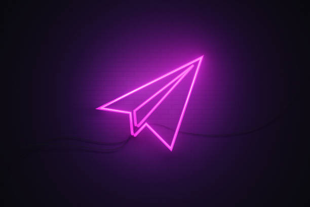 istock Plane Symbol Drawn by Purple Neon Light on Black Wall 1249090075