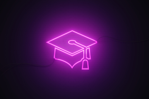 Tassel drawn by purple neon light on black wall. Horizontal composition with copy space. Great use for webinar concepts.