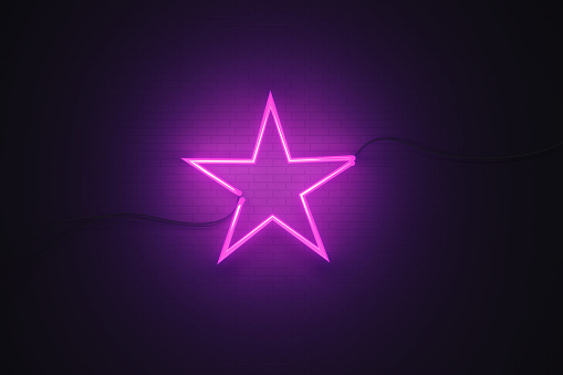 Star drawn by purple neon light on black wall. Horizontal composition with copy space. Great use for VIP and feedback concepts.