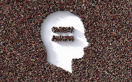 Human head and equal sign formed by human crowd on white background. Horizontal composition with clipping path and copy space. Social justice and equality concept.