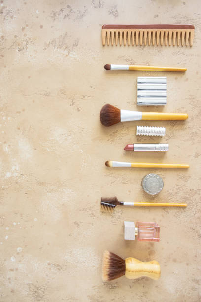 istock Eco friendly beauty accessories. Bamboo makeup tools, perfume, metal lipstick tub and shadow box,wood hair brush on beige concrete background . Eco packaging, plastic free and zero waste cosmetic tools. 1249100665
