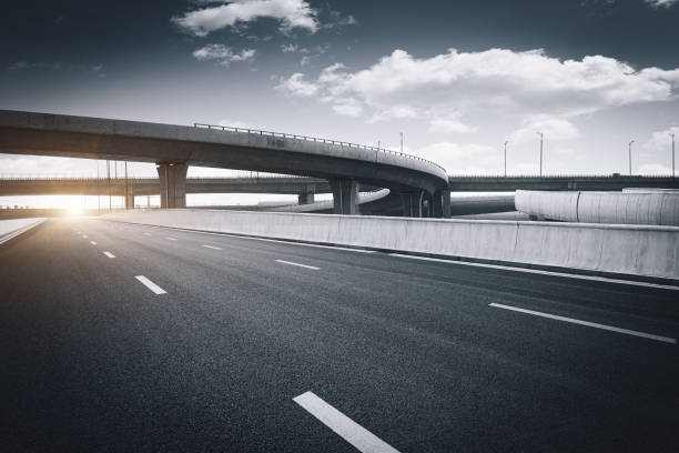 istock Clear blue sky and white clouds in the background, highway overpass curved approach bridge 1249100819
