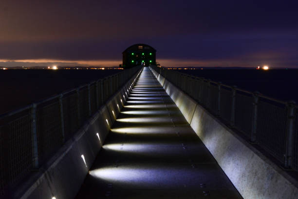 bridge to faro beach in algarve at night