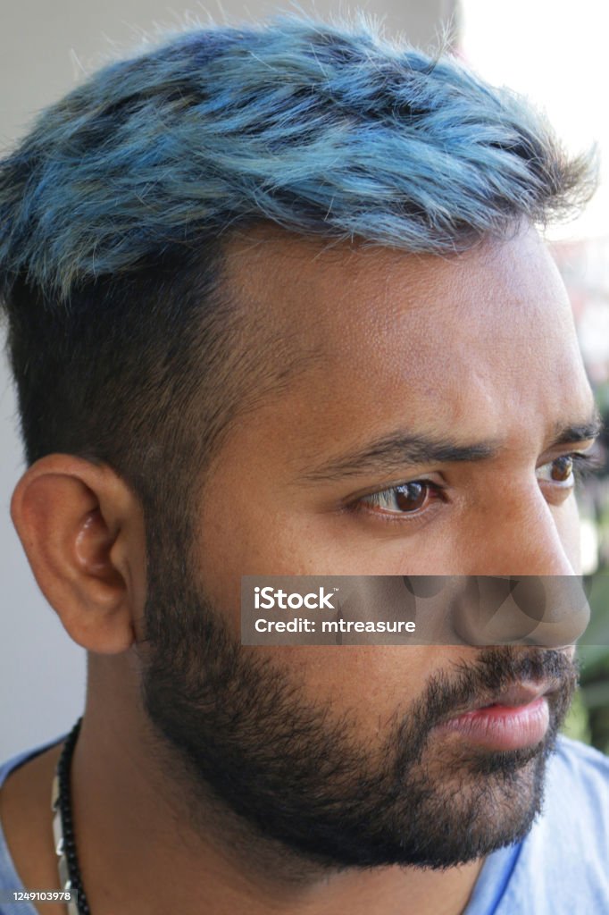 Image Of Handsome Hindu Man With Blue Hair In Early 20s Side Profile  Smiling Short Beard Dyed Bleached Messy Electric Blue Coloured Hair Closeup  Portrait Of Good Looking Guy In Blue Tshirt