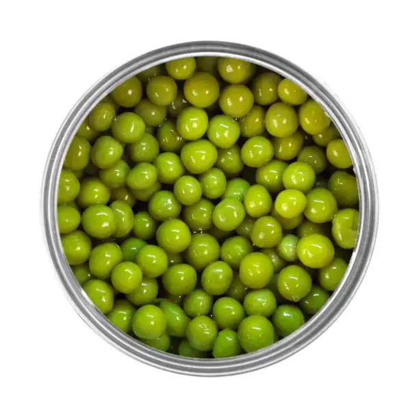 Green peas in a can. Close up. Isolated on a white background.