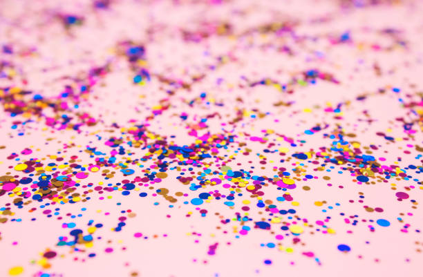 istock Colorful sparkles on trendy pink pastel background for your creative projects and design. Festive celebration concept. Selective focus 1249110587