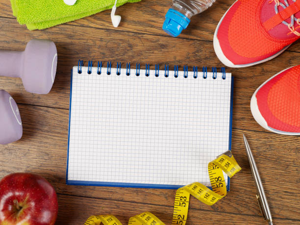 istock Notebook and fitness equipment 1249114520
