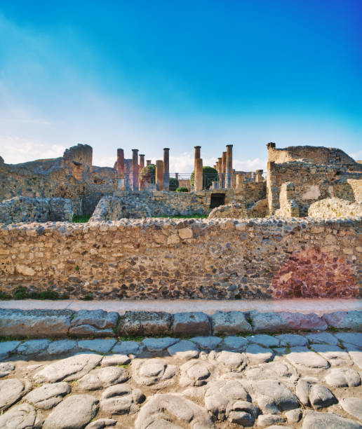 Looking at the ancient city of Pompeii. Pompeii is an ancient Roman city that was buried under 4 to 6 m (13 to 20 ft) of volcanic ash and pumice in the eruption of Mount Vesuvius in AD 79. Today Pompeii is a UNESCO World Heritage Site and is one of the most popular tourist attractions in Italy.