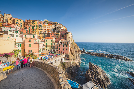 Cinque terre , June 08 2017 ; Italy Tourist enjoy traveling view of village Riomaggiore town in Cinque terre nature park. Liguria Italy ,Travel and vacation destination in Italy and Europe