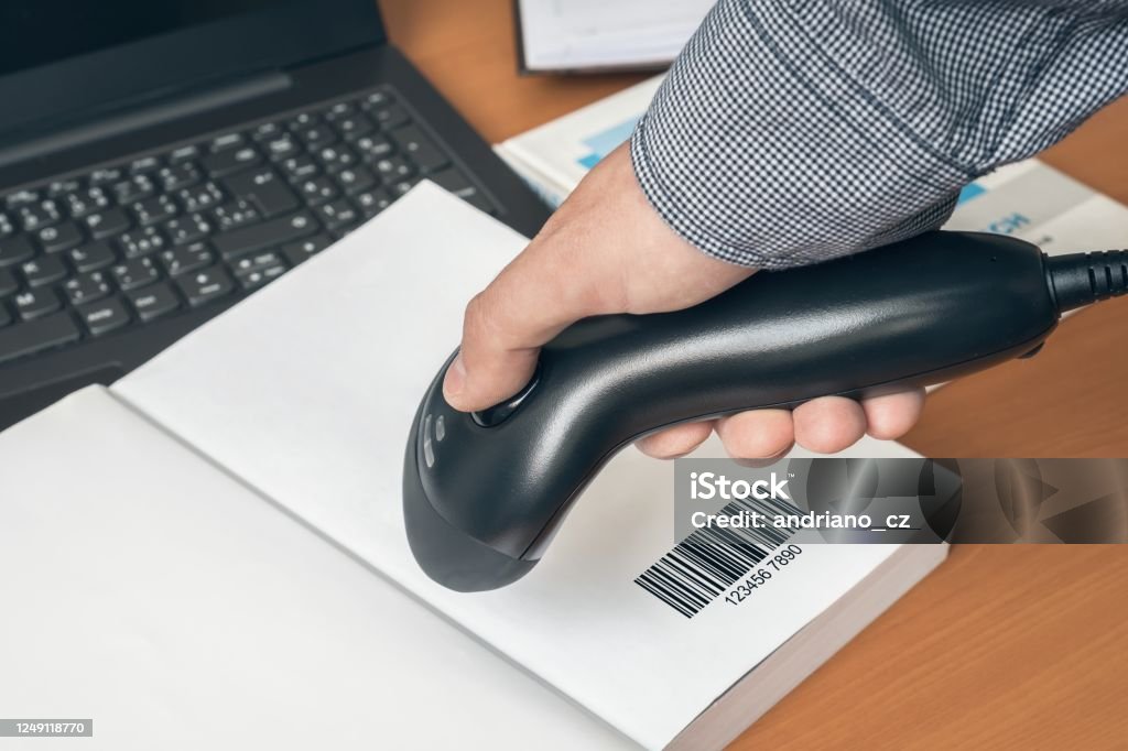 Scanning Code Magazine Man With Scanner Scans Barcode In A Book Stock Photo - Download Image ...