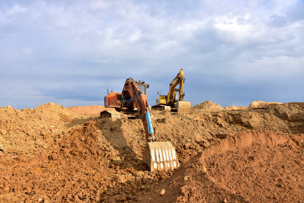 istock Digging the pit foundation a hole with excavator. Earthwork in excavation and backfilling of soil upto required depth is required for construction of trenche 1249118891