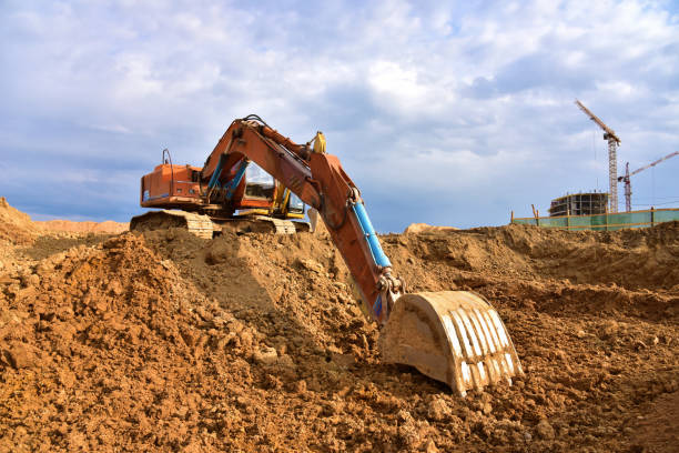 istock Digging the pit foundation a hole with excavator. Earthwork in excavation and backfilling of soil upto required depth is required for construction of trenche 1249121487