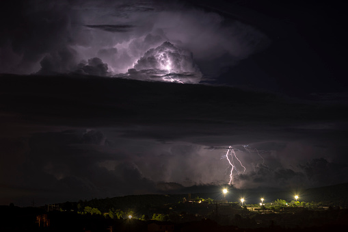 Night thunderstorm over the city, Sardinia, Italy