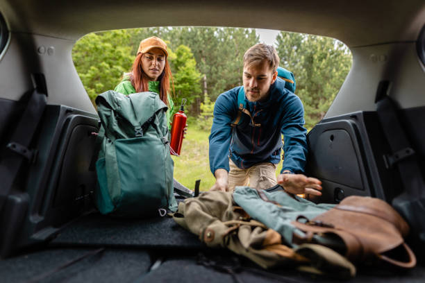 istock Travel couple checking if everything is packed before they go on a trial hiking 1249126171