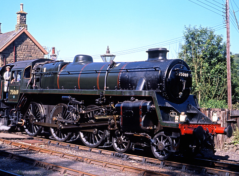 British Railways Standard Class 4 4-6-0 steam locomotive number 75069 pulling out of Severn Valley railway Station, Highley, Shropshire, England, UK, Western Europe.