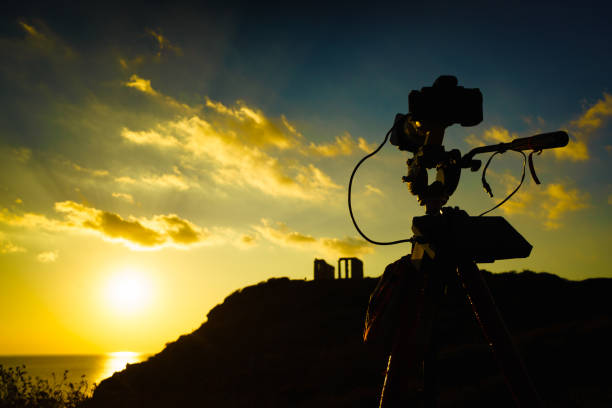 istock Camera and greek temple of Poseidon, Cape Sounio 1249137978