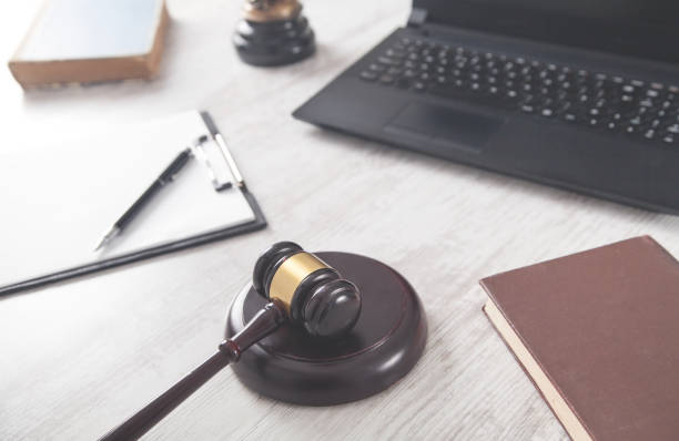 istock Judge gavel with a other objects on a white desk. Law concept 1249141524