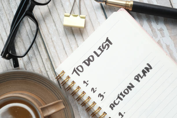 istock tea cup and notebook with to do list on wooden table 1249143810