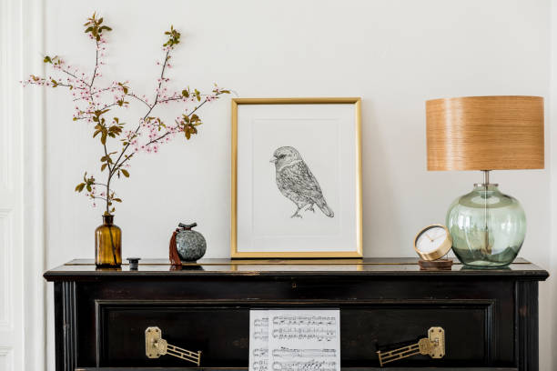 stylish composition at living room interior with black piano, gold mock up poster frame, dried flowers and elegant presonal accessories in modern home decor. - piano interior imagens e fotografias de stock